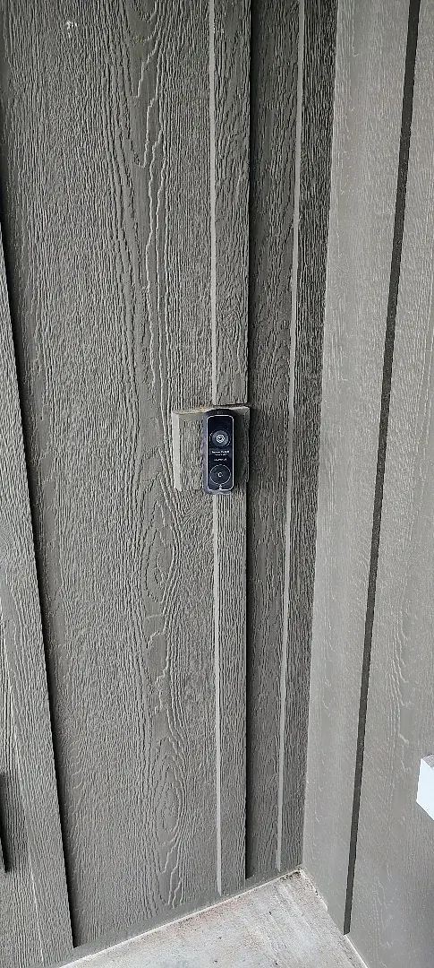 Doorbell camera mounted beside the entry