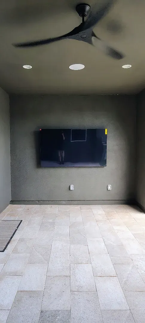 Mounted patio TV and two ceiling speakers at a home in Surprise, Arizona